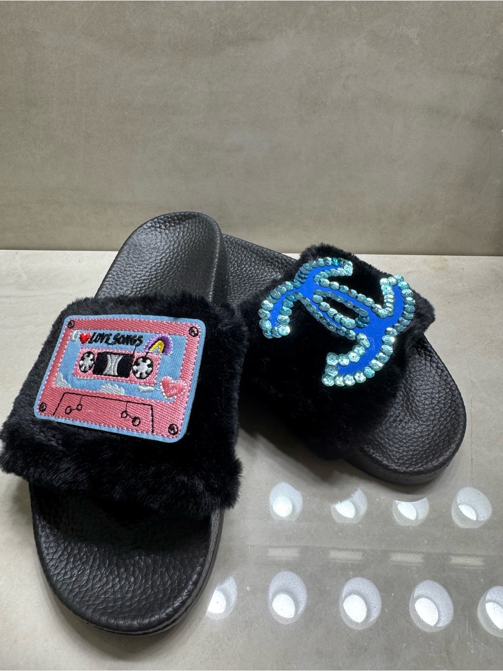 Black Fuzzy Slide Sandals with Sequin Logo & Pink Cassette Patch